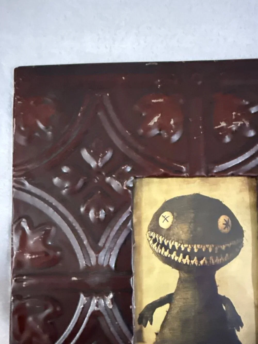 Vintage Embossed Tin Photo Frame With Gothic Motif And Creepy Doll Artwork